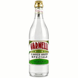 Clear glass bottle of VARNELLI l’Anice Secco Speciale with a gold cap and green–white label accents (distilleria VARNELLI).